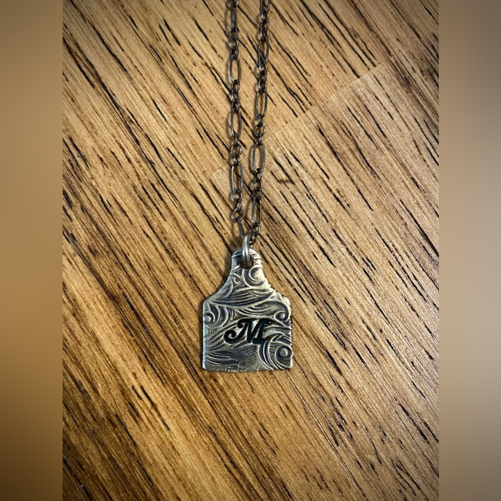 “M” initial cow tag tooled sterling silver necklace